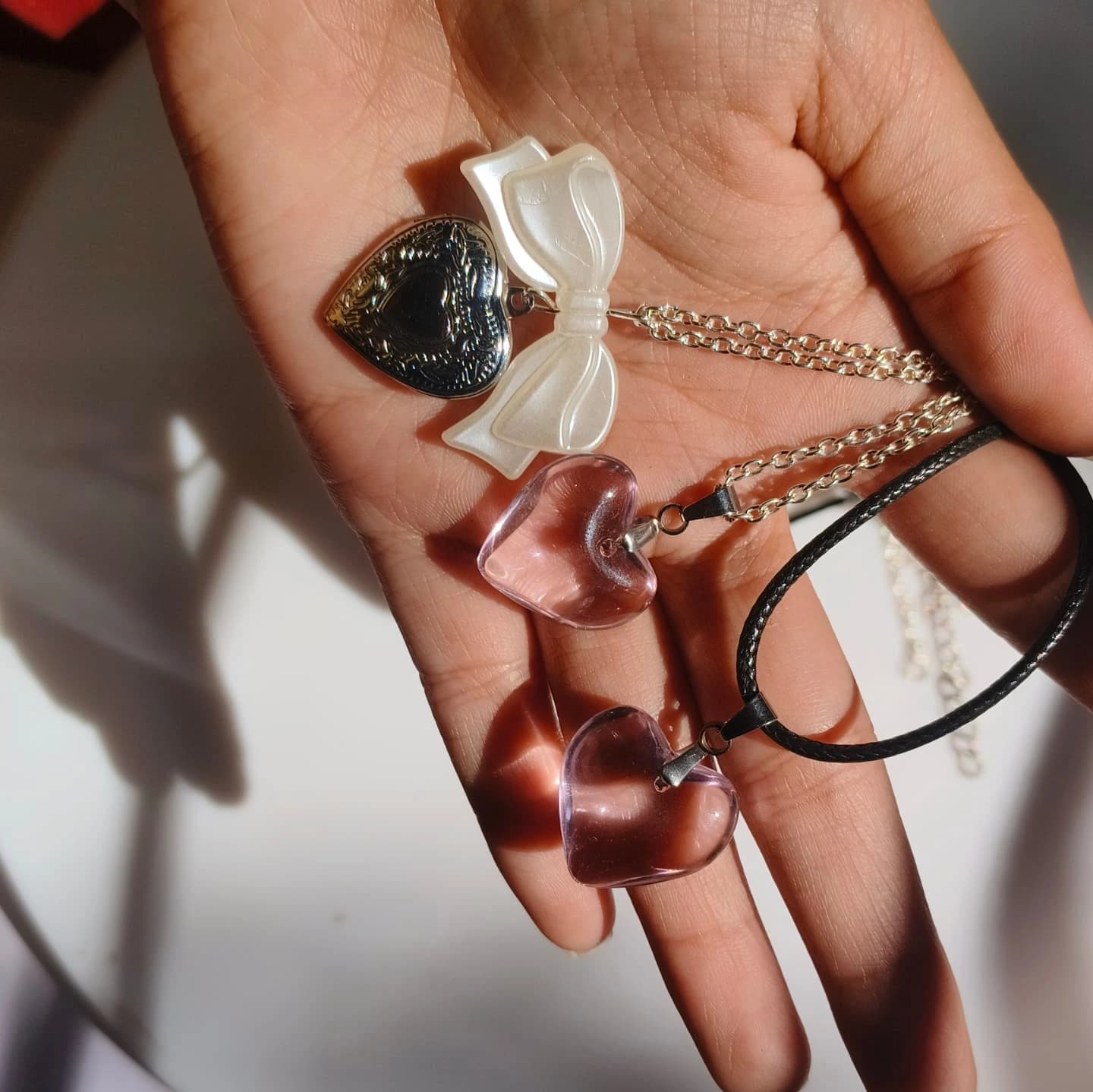 Elegant Heart Pendant Necklace Set – 3 Designs (Pink Glass & Ribbon Accent)